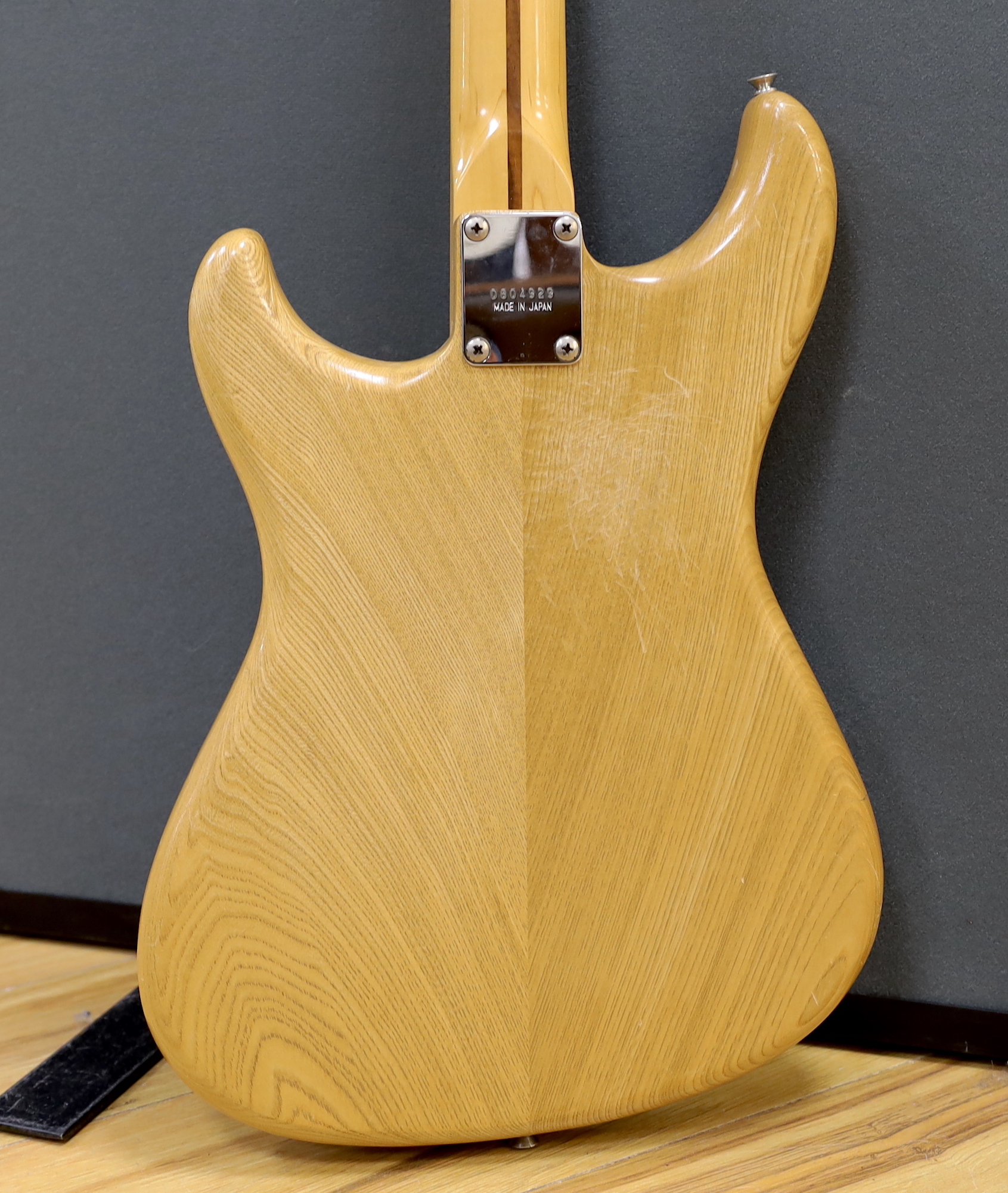 A 1980 Electric guitar by Ibanez, Japan, Blazer Series in natural finish with flight case and a small Fender Frontman 15G amp